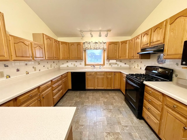 kitchen with black appliances, backsplash, sink, and vaulted ceiling