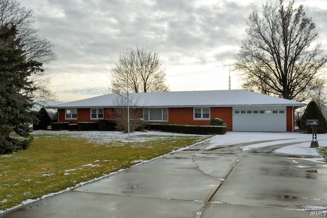 single story home with a front yard and a garage