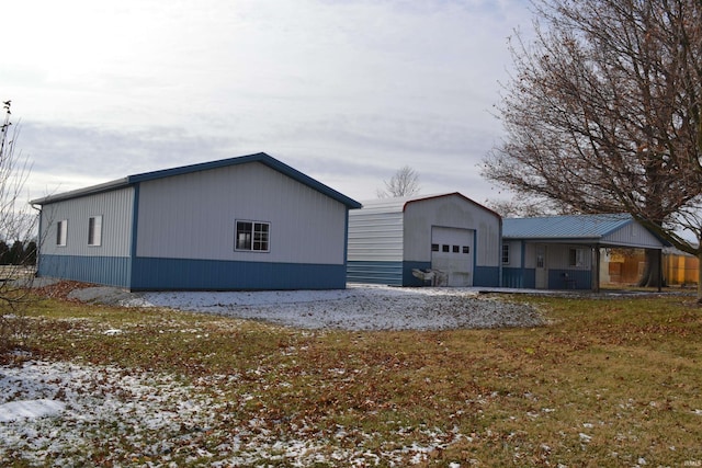 view of snowy exterior with a garage