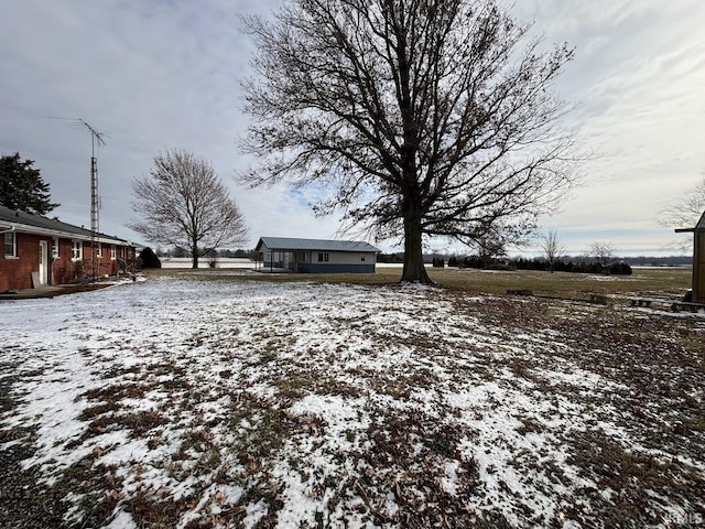 view of yard layered in snow