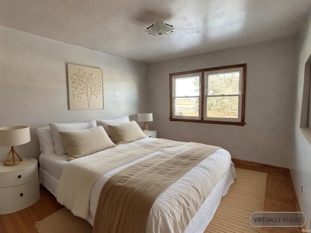 bedroom with light hardwood / wood-style flooring