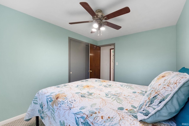 carpeted bedroom featuring ceiling fan