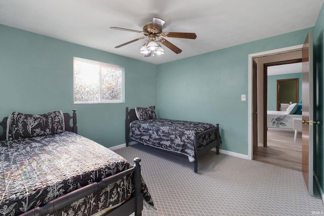 carpeted bedroom with ceiling fan