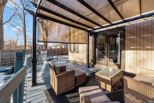 wooden deck featuring french doors and a pergola