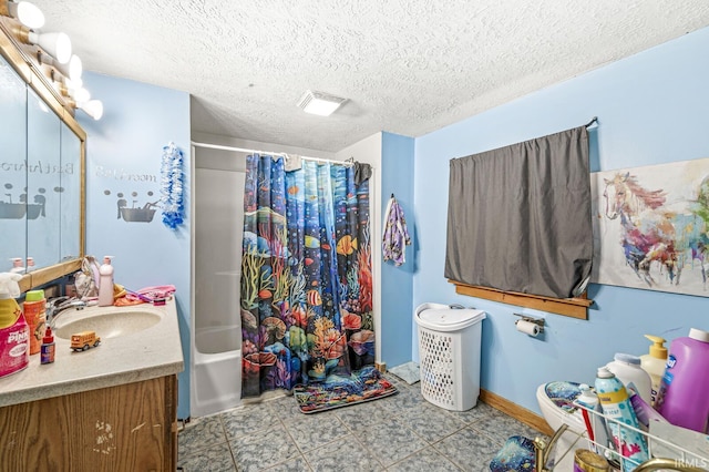 bathroom with tile patterned flooring, a textured ceiling, vanity, and shower / tub combo with curtain