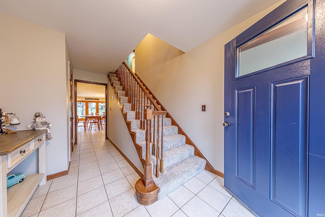 foyer featuring light tile patterned floors