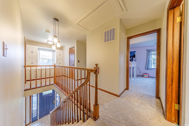 hallway with light carpet