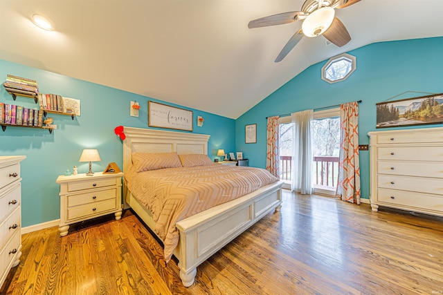 bedroom with hardwood / wood-style floors, ceiling fan, lofted ceiling, and access to outside