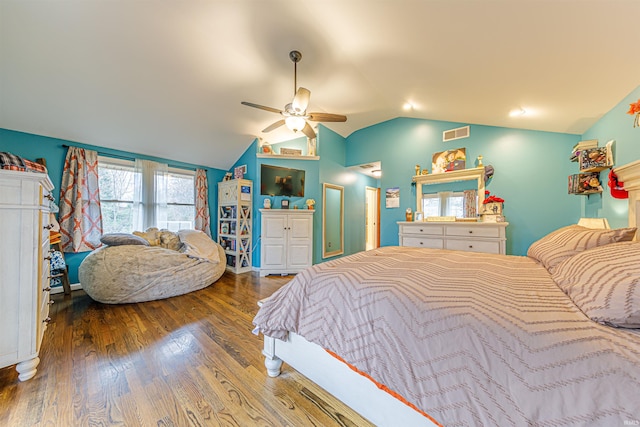 bedroom with hardwood / wood-style flooring, ceiling fan, and lofted ceiling