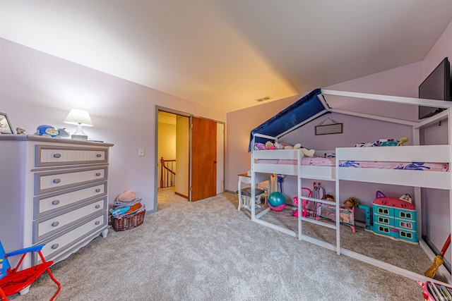 bedroom featuring carpet flooring and lofted ceiling