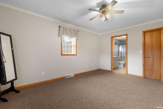 unfurnished bedroom with light colored carpet, ensuite bath, and crown molding