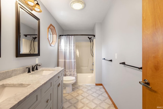 full bathroom featuring shower / bath combo, vanity, and toilet