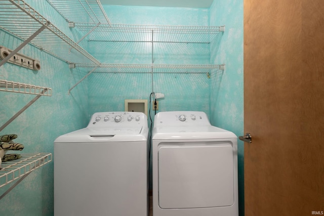 laundry area featuring independent washer and dryer