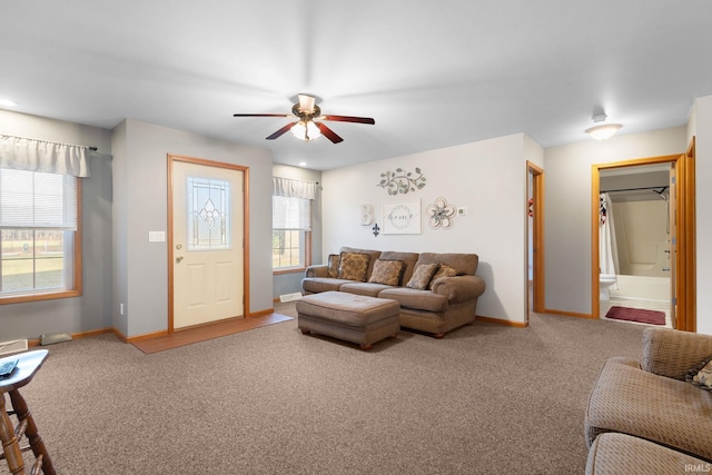 living room featuring carpet flooring and ceiling fan