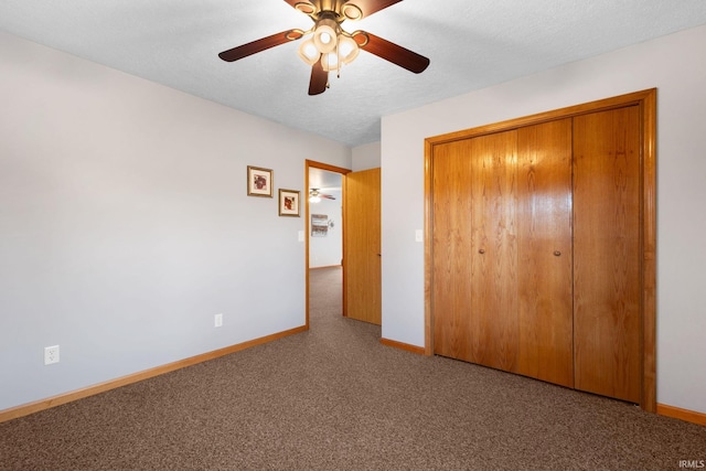 unfurnished bedroom featuring ceiling fan, a textured ceiling, and a closet