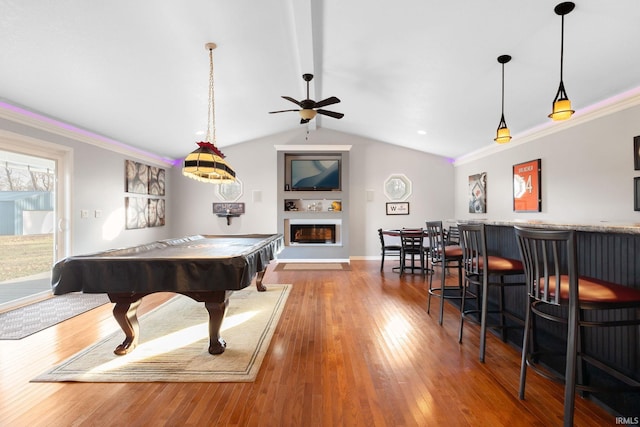 game room with ornamental molding, vaulted ceiling, ceiling fan, hardwood / wood-style floors, and pool table