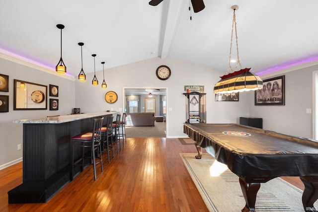 rec room with hardwood / wood-style floors, lofted ceiling with beams, ceiling fan, bar, and pool table