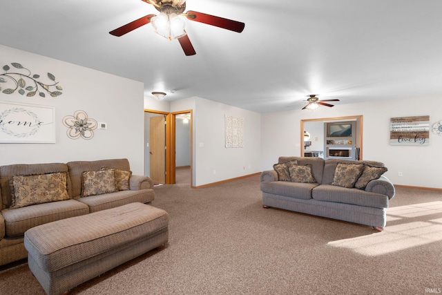 carpeted living room featuring ceiling fan