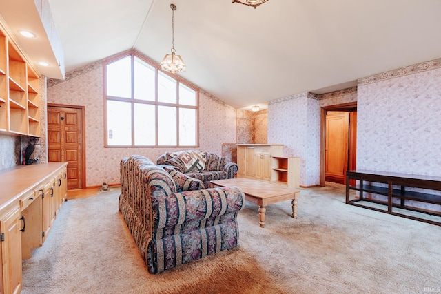 living room with lofted ceiling, light carpet, and an inviting chandelier