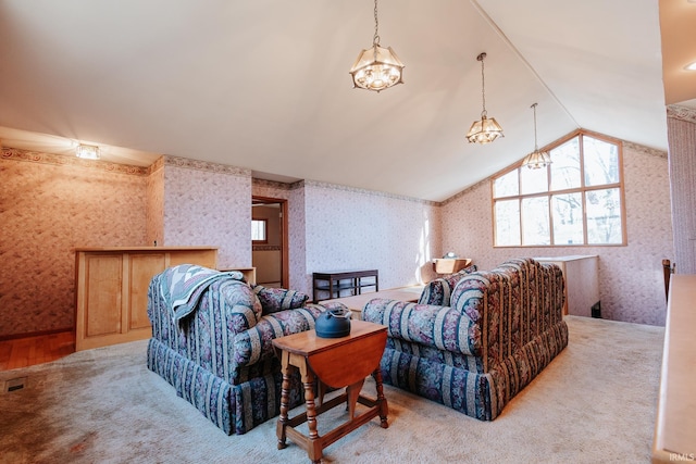 living room featuring lofted ceiling, carpet floors, and an inviting chandelier