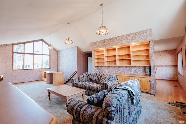 living room with light colored carpet, built in features, and lofted ceiling