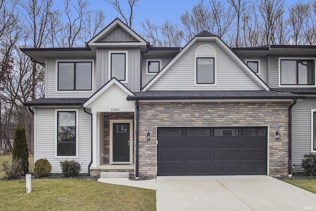 view of front of property featuring a garage and a front lawn