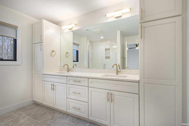 bathroom with vanity and an enclosed shower