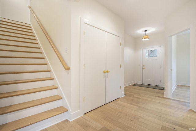 foyer entrance with light hardwood / wood-style flooring