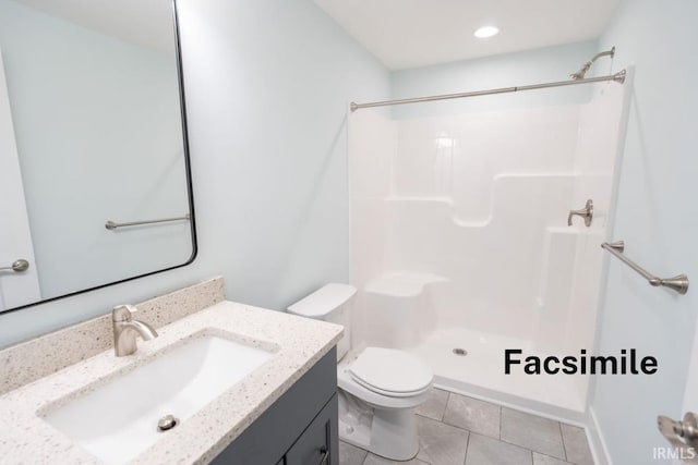 bathroom featuring tile patterned flooring, vanity, toilet, and walk in shower