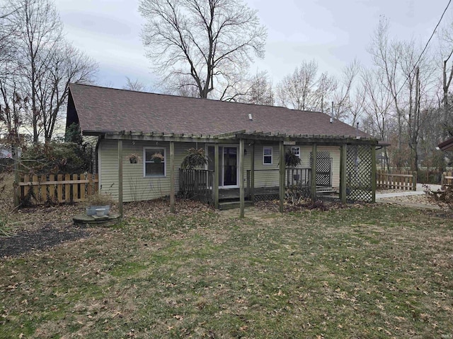 back of property featuring a lawn