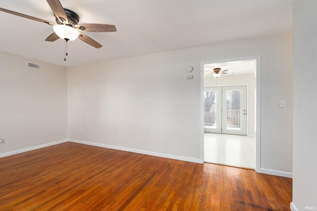 spare room with french doors, hardwood / wood-style flooring, and ceiling fan