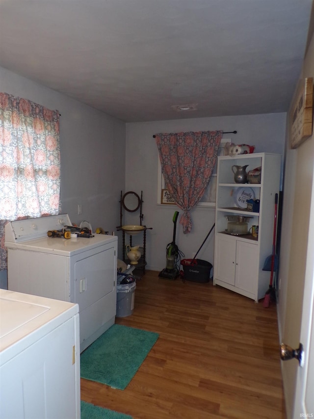 washroom featuring separate washer and dryer and wood-type flooring