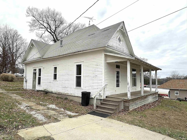 view of property exterior with a porch