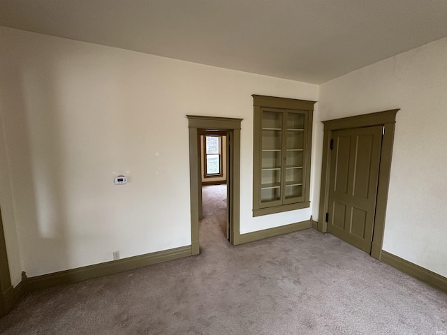 empty room with light colored carpet