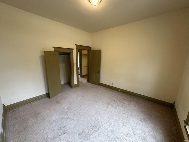 unfurnished bedroom with light carpet