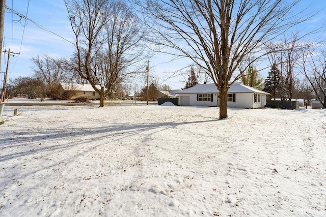 view of yard layered in snow