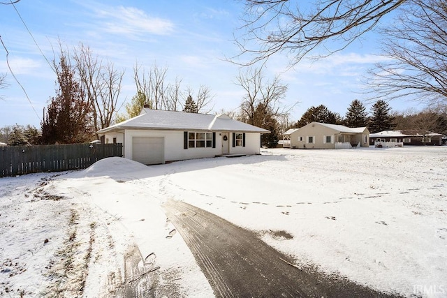 single story home featuring a garage