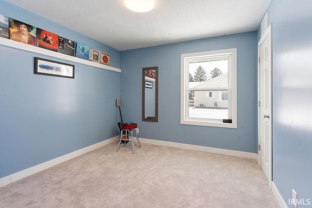 empty room featuring light carpet