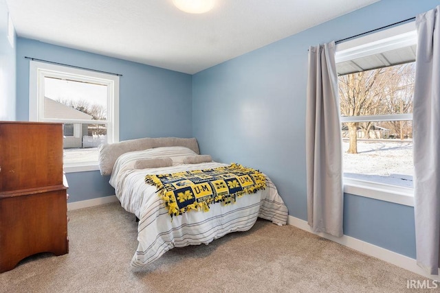 bedroom featuring light carpet