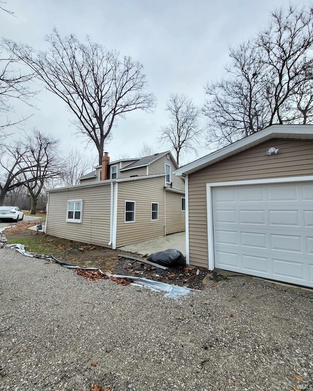 view of side of property with a garage