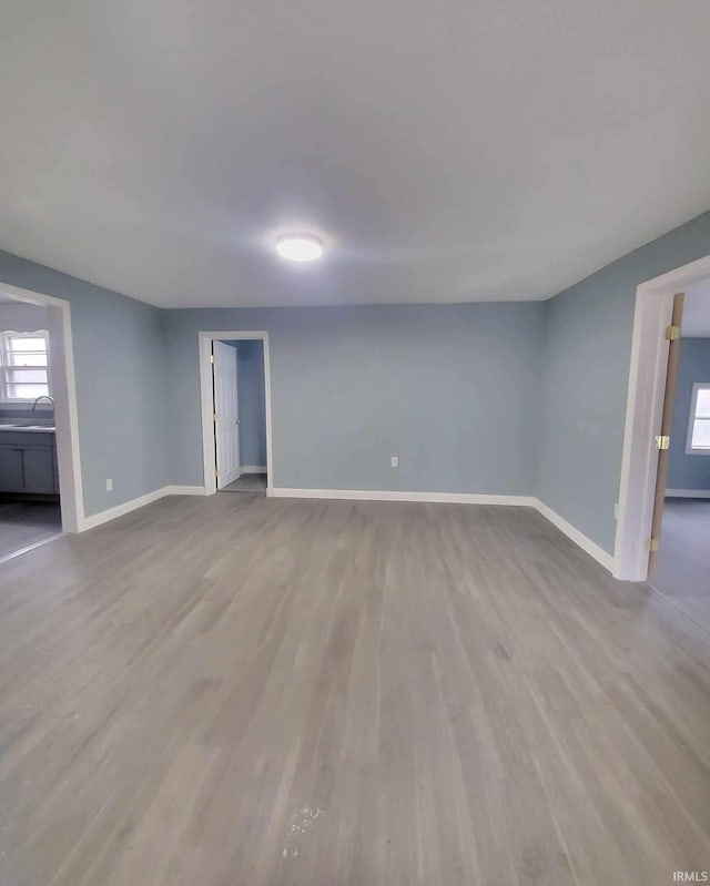 spare room featuring light hardwood / wood-style flooring and sink