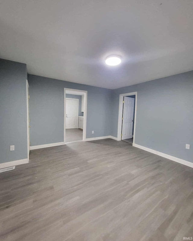 spare room featuring light wood-type flooring