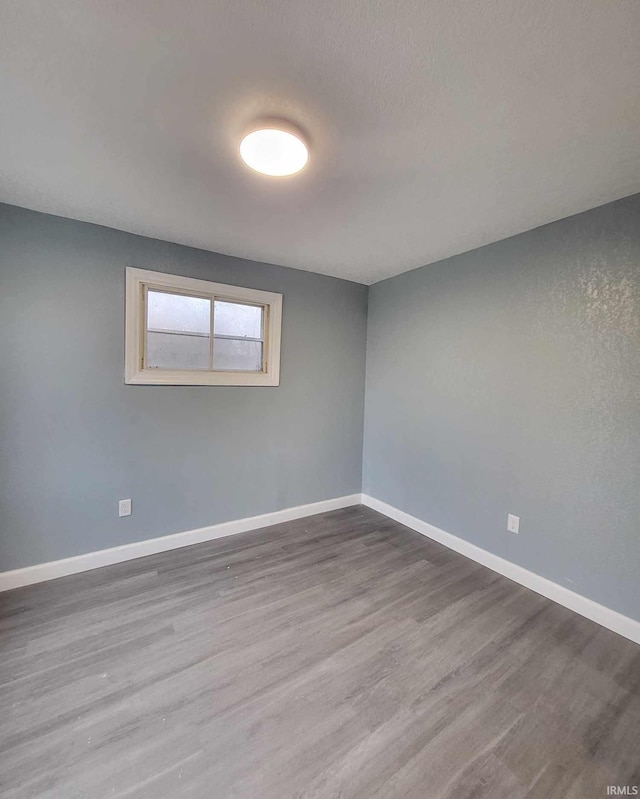 empty room featuring hardwood / wood-style floors