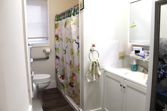 full bathroom with toilet, hardwood / wood-style floors, vanity, and shower / tub combo with curtain