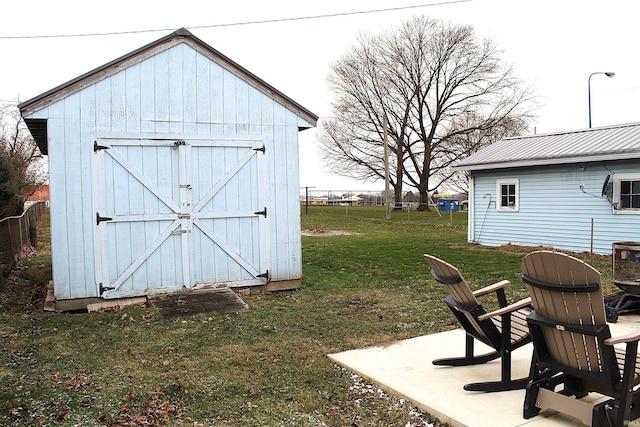 view of outdoor structure with a lawn