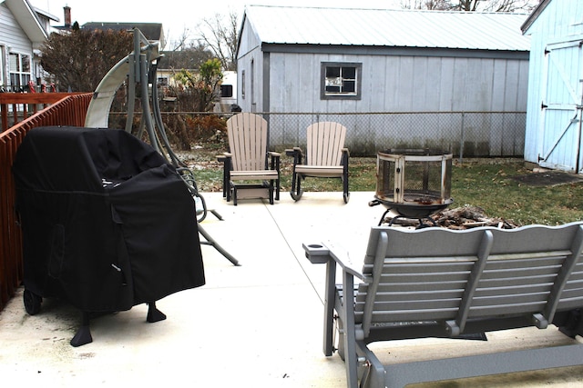 view of patio featuring a fire pit and grilling area