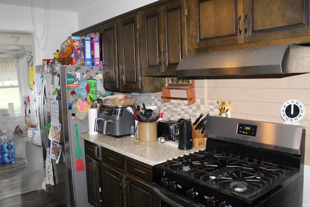 kitchen featuring decorative backsplash, dark brown cabinets, stainless steel appliances, and dark hardwood / wood-style floors