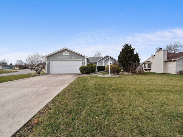 ranch-style home featuring a garage and a front lawn