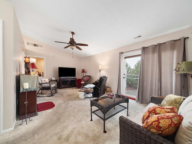 living room featuring ceiling fan, lofted ceiling, and light carpet