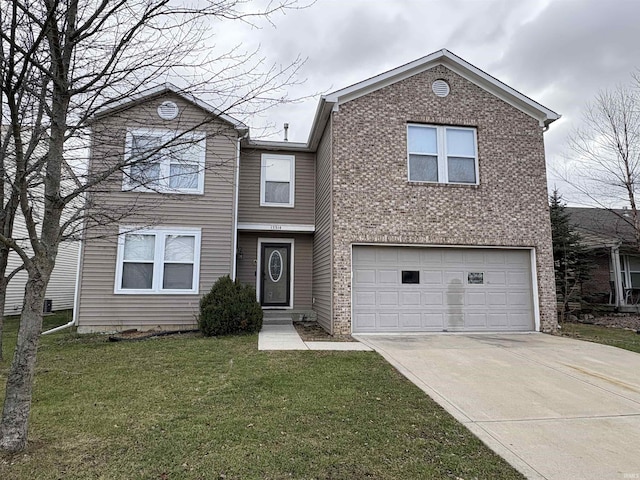 view of front property featuring a front yard and a garage